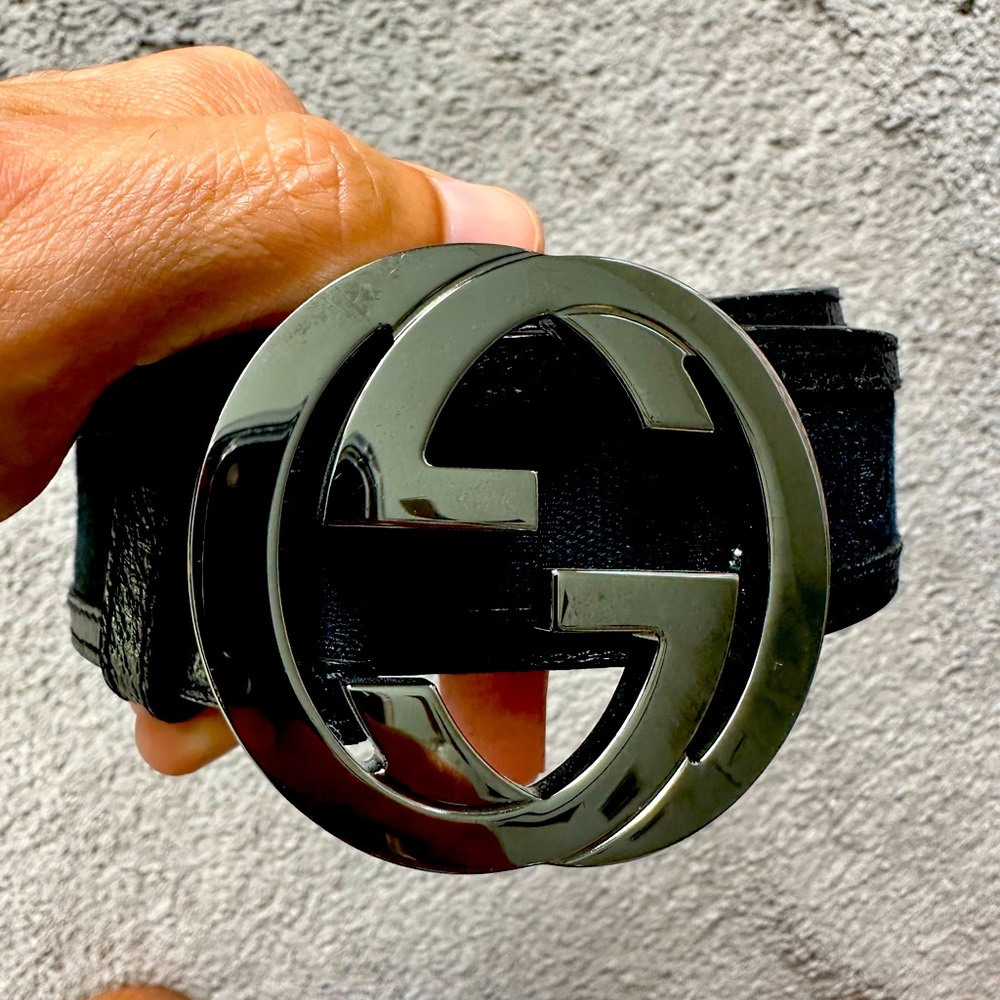 Classic Double G leather and vinyl belt with Gucci monograms all throughout.